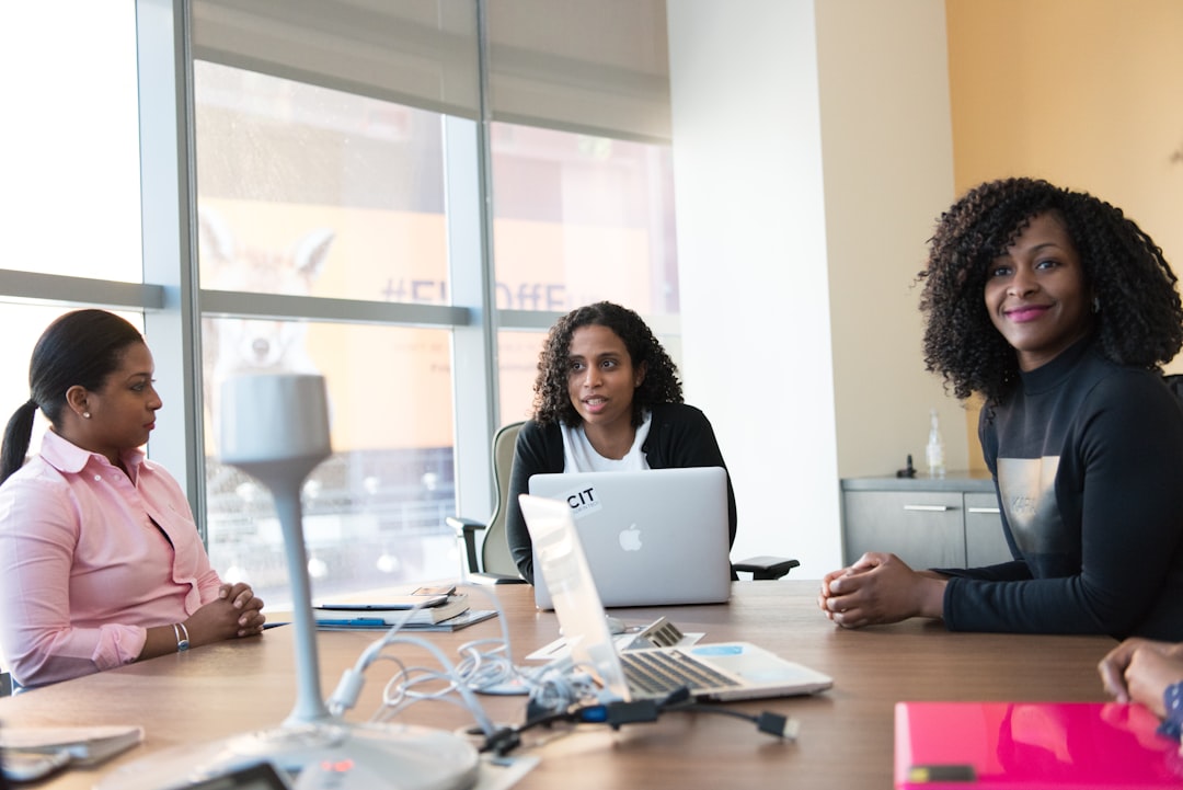 Professionals collaborating around a table during a brand strategy discussion