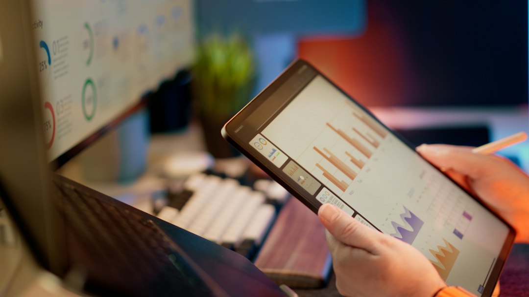 Modern workspace with digital analytics displayed on screen